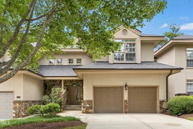 95113 Vance Knls, Chapel Hill, NC 27517 - view of front facade with stone siding, stucco siding, and a garage