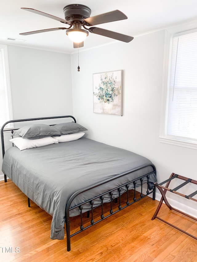 2907 University Dr, Durham, NC 27707 - bedroom with wood finished floors and a ceiling fan