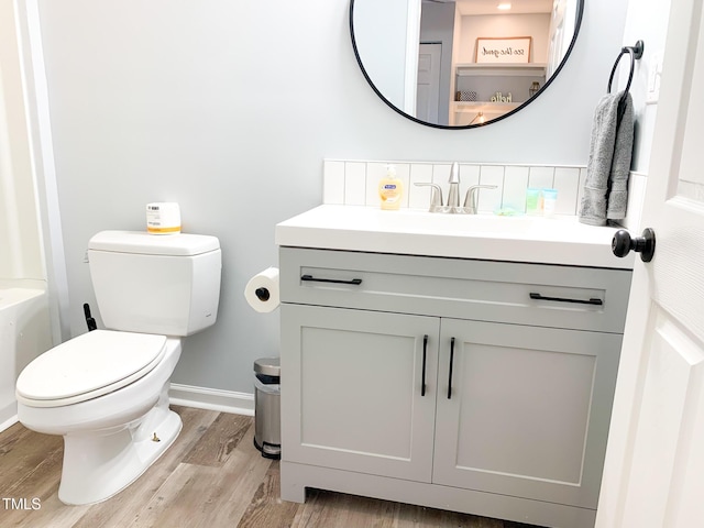 2907 University Dr, Durham, NC 27707 - bathroom featuring vanity, wood finished floors, and a bath