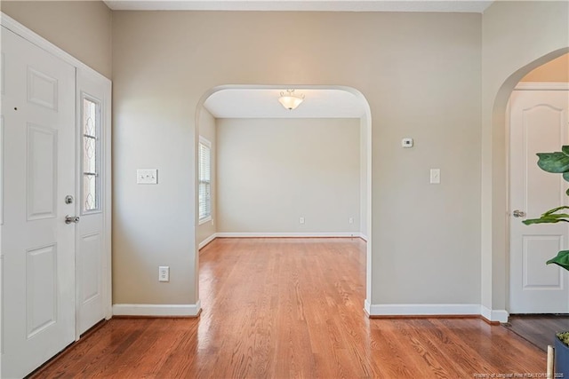4055 Beaubien Dr, Fayetteville, NC 28306 - entrance foyer with arched walkways, wood finished floors, and baseboards