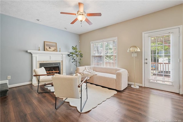 4055 Beaubien Dr, Fayetteville, NC 28306 - living area featuring healthy amount of natural light, dark wood finished floors, ceiling fan, and a textured ceiling