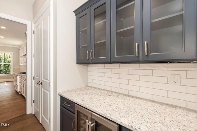 59 Cardinal Dr, Whispering Pines, NC 28327 - bar featuring wine cooler, dark wood-style floors, crown molding, tasteful backsplash, and recessed lighting