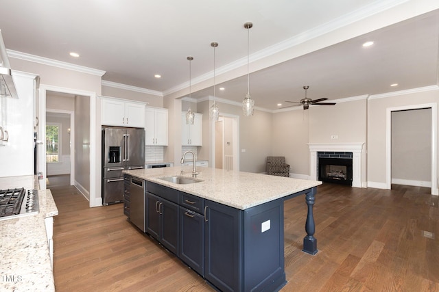 59 Cardinal Dr, Whispering Pines, NC 28327 - kitchen with a sink, appliances with stainless steel finishes, ceiling fan, white cabinets, and dark wood-style flooring