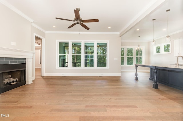 59 Cardinal Dr, Whispering Pines, NC 28327 - unfurnished living room with a ceiling fan, light wood-style flooring, recessed lighting, a tiled fireplace, and baseboards