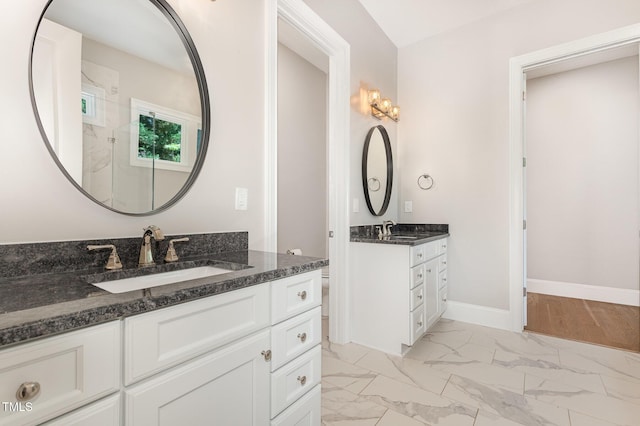 59 Cardinal Dr, Whispering Pines, NC 28327 - bathroom with marble look tiles, two vanities, toilet, baseboards, and a shower