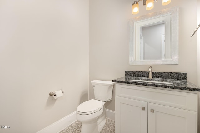 59 Cardinal Dr, Whispering Pines, NC 28327 - half bathroom with baseboards, vanity, toilet, and tile patterned floors