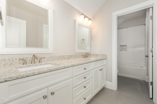 59 Cardinal Dr, Whispering Pines, NC 28327 - bathroom featuring double vanity, toilet, bathtub / shower combination, baseboards, and tile patterned flooring