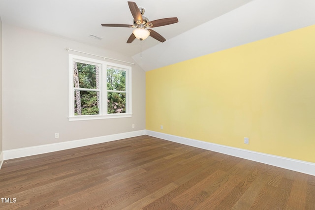 59 Cardinal Dr, Whispering Pines, NC 28327 - spare room with lofted ceiling, dark wood-style floors, baseboards, and ceiling fan