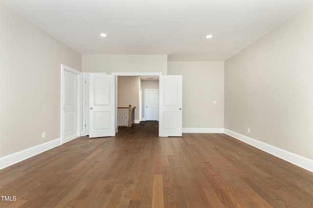 59 Cardinal Dr, Whispering Pines, NC 28327 - unfurnished bedroom featuring baseboards, dark wood-type flooring, and recessed lighting