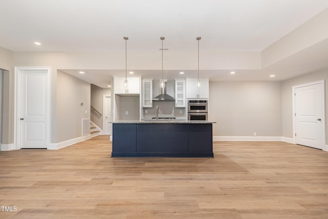 59 Cardinal Dr, Whispering Pines, NC 28327 - kitchen featuring wall chimney range hood, white cabinetry, double oven, baseboards, and recessed lighting
