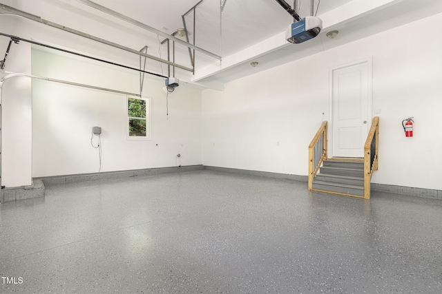 59 Cardinal Dr, Whispering Pines, NC 28327 - garage with a garage door opener and baseboards