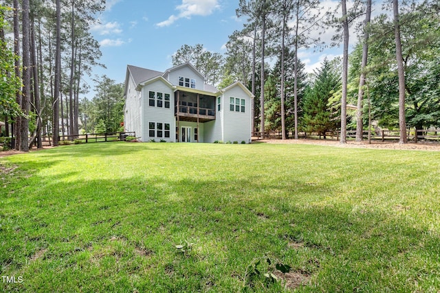 59 Cardinal Dr, Whispering Pines, NC 28327 - back of property featuring a sunroom