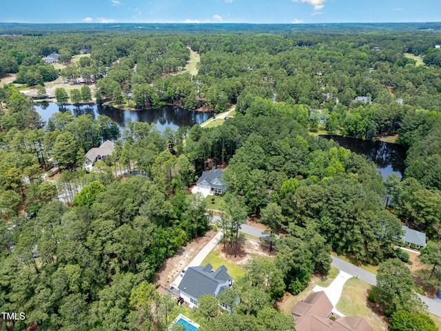 59 Cardinal Dr, Whispering Pines, NC 28327 - aerial view of property's location with a forest and a nearby body of water