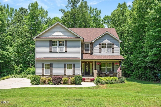 110 Lexington Ave, Zebulon, NC 27597 - craftsman-style house with a porch, stone siding, a front lawn, and roof with shingles