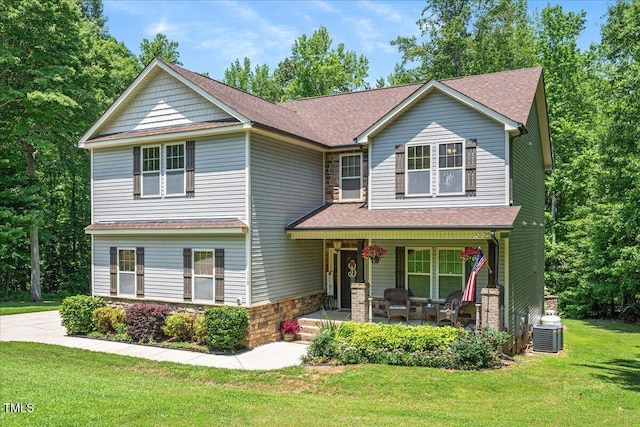 110 Lexington Ave, Zebulon, NC 27597 - view of front of property with a porch, a front lawn, central air condition unit, stone siding, and a shingled roof