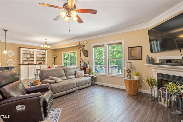 110 Lexington Ave, Zebulon, NC 27597 - living area featuring wood finished floors, ornamental molding, a fireplace, a chandelier, and a ceiling fan