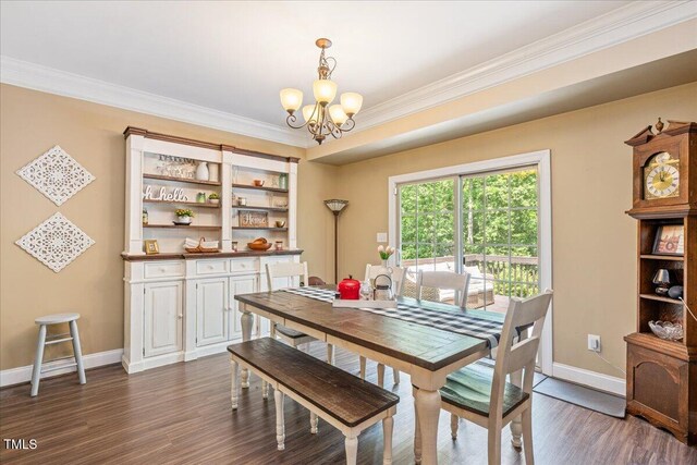 110 Lexington Ave, Zebulon, NC 27597 - dining room with a chandelier, baseboards, dark wood-style floors, and ornamental molding