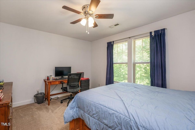 110 Lexington Ave, Zebulon, NC 27597 - carpeted bedroom with baseboards, a desk, and ceiling fan