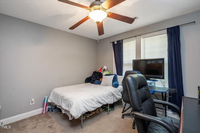 110 Lexington Ave, Zebulon, NC 27597 - carpeted bedroom featuring baseboards and a ceiling fan