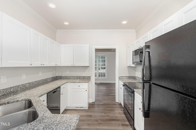 7936 Milltrace, Raleigh, NC 27615 - kitchen featuring black appliances, white cabinetry, crown molding, light stone counters, and light wood finished floors