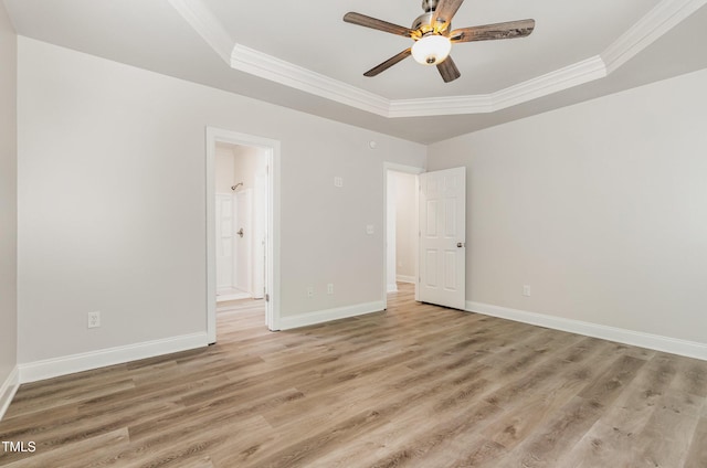 7936 Milltrace, Raleigh, NC 27615 - empty room featuring a tray ceiling, crown molding, light wood-style flooring, a ceiling fan, and baseboards