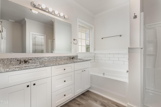 7936 Milltrace, Raleigh, NC 27615 - bathroom with double vanity, a bath, wood finished floors, and ornamental molding