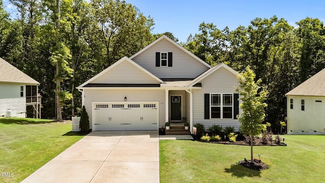 159 Clear Water Rd, Louisburg, NC 27549 - traditional-style home with a garage, driveway, a front yard, and central AC