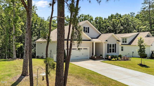 159 Clear Water Rd, Louisburg, NC 27549 - view of front of home featuring concrete driveway, a front yard, and an attached garage