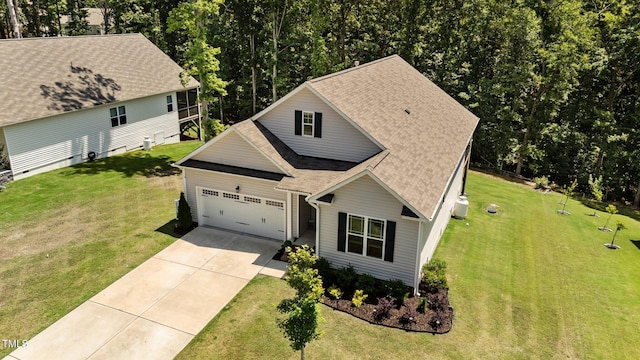 159 Clear Water Rd, Louisburg, NC 27549 - traditional home with an attached garage, roof with shingles, driveway, and a front yard
