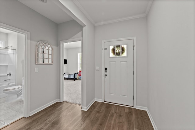 159 Clear Water Rd, Louisburg, NC 27549 - entrance foyer with dark wood-type flooring, baseboards, and ornamental molding