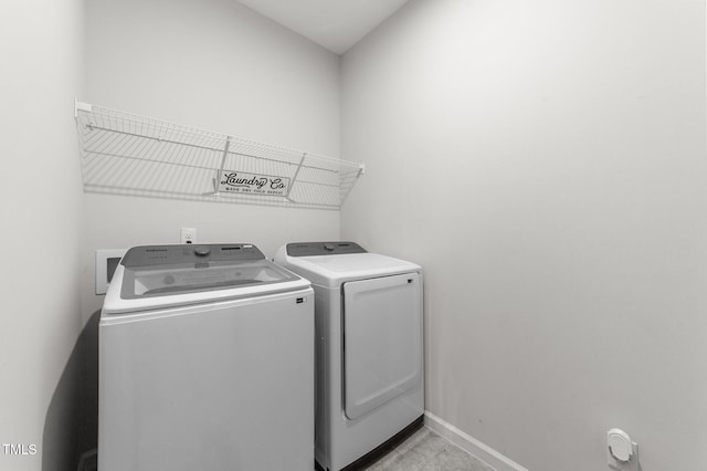 159 Clear Water Rd, Louisburg, NC 27549 - laundry area with washing machine and dryer and baseboards