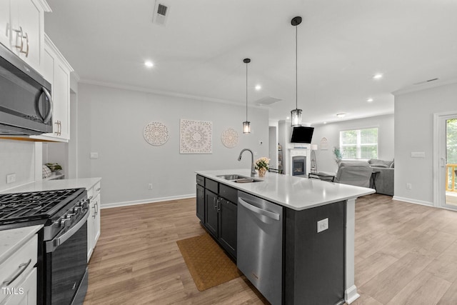 159 Clear Water Rd, Louisburg, NC 27549 - kitchen featuring stainless steel appliances, a sink, light wood-style floors, light countertops, and recessed lighting