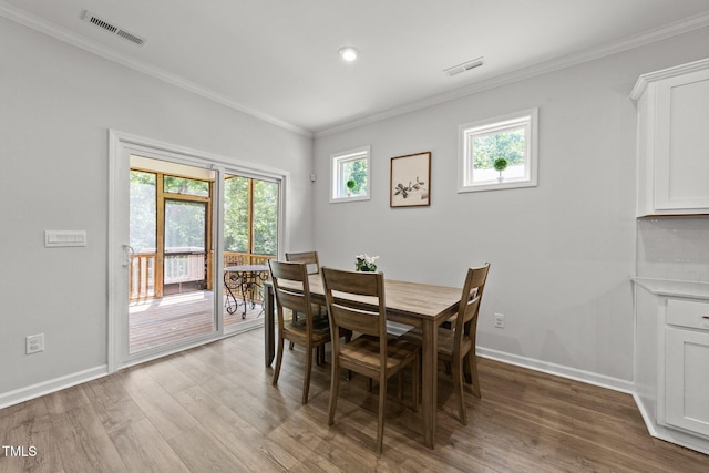 159 Clear Water Rd, Louisburg, NC 27549 - dining area with wood finished floors, ornamental molding, and baseboards