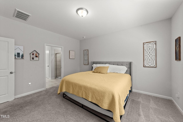 159 Clear Water Rd, Louisburg, NC 27549 - bedroom featuring light colored carpet, baseboards, and ensuite bath