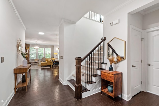 1577 Tice Hurst Ln, Apex, NC 27502 - stairway with wood finished floors, crown molding, baseboards, and a chandelier