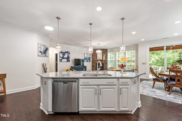 1577 Tice Hurst Ln, Apex, NC 27502 - kitchen with stainless steel dishwasher, a sink, an island with sink, baseboards, and light stone countertops