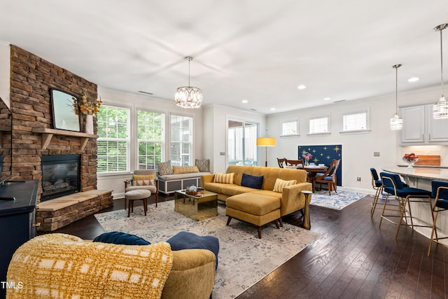 1577 Tice Hurst Ln, Apex, NC 27502 - living room with dark wood-style floors, baseboards, recessed lighting, crown molding, and a stone fireplace