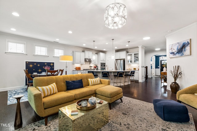 1577 Tice Hurst Ln, Apex, NC 27502 - living room featuring dark wood-type flooring, crown molding, recessed lighting, baseboards, and arched walkways