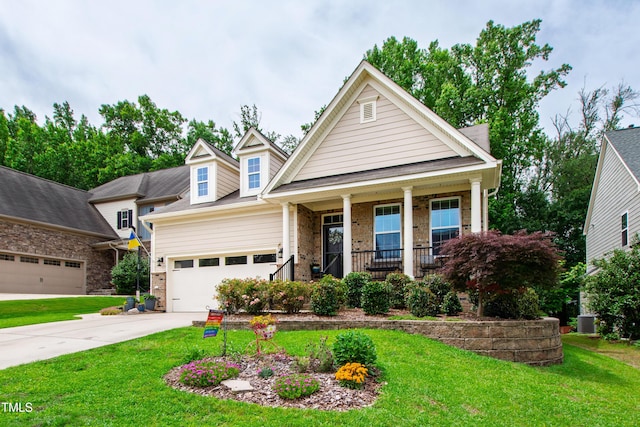1577 Tice Hurst Ln, Apex, NC 27502 - view of front of home with a porch, a front yard, driveway, and a garage