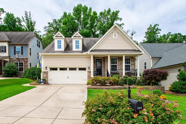 1577 Tice Hurst Ln, Apex, NC 27502 - view of front of property with covered porch, an attached garage, concrete driveway, a front yard, and brick siding