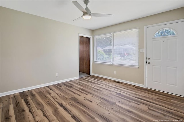 1486 Thelbert Dr, Fayetteville, NC 28301 - foyer entrance featuring wood finished floors, baseboards, and a ceiling fan