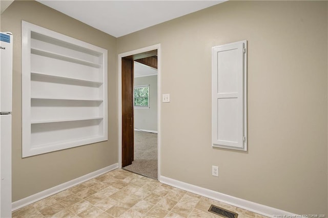 1486 Thelbert Dr, Fayetteville, NC 28301 - unfurnished room with built in shelves and baseboards