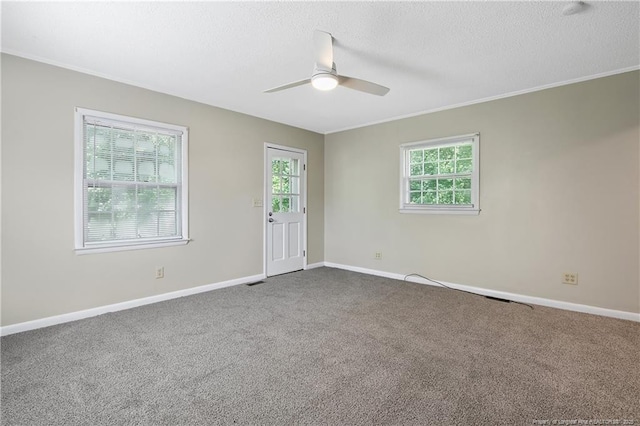 1486 Thelbert Dr, Fayetteville, NC 28301 - carpeted spare room featuring ceiling fan, plenty of natural light, baseboards, a textured ceiling, and ornamental molding