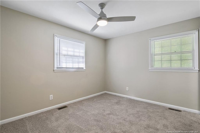 1486 Thelbert Dr, Fayetteville, NC 28301 - spare room featuring carpet flooring, healthy amount of natural light, ceiling fan, and baseboards