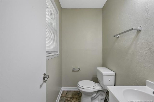 1486 Thelbert Dr, Fayetteville, NC 28301 - half bath featuring toilet, baseboards, and vanity
