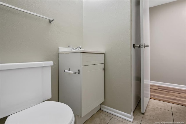 1486 Thelbert Dr, Fayetteville, NC 28301 - half bathroom with vanity, toilet, tile patterned flooring, and baseboards