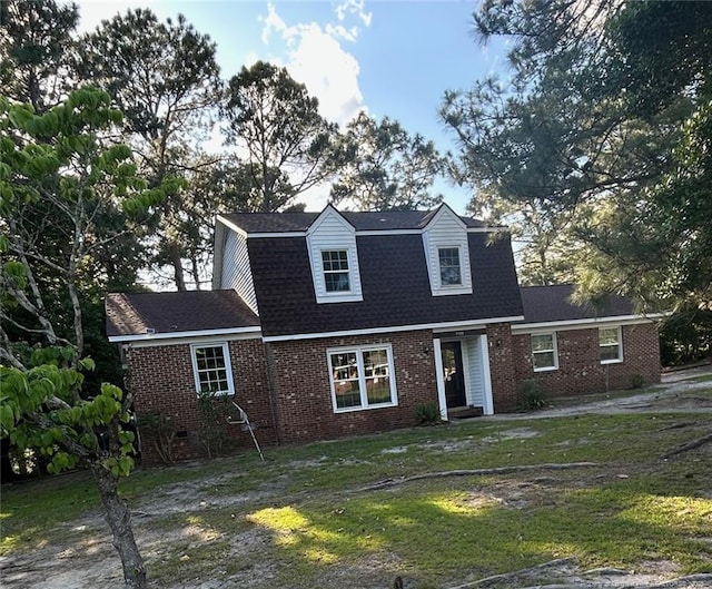 1720 Paisley Ave, Fayetteville, NC 28304 - colonial inspired home with brick siding, roof with shingles, a front lawn, and a gambrel roof