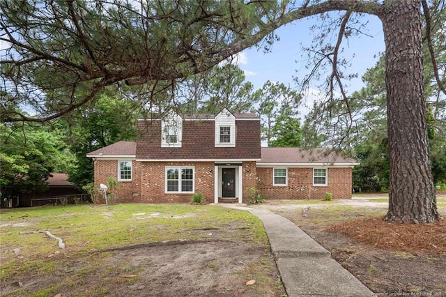 1720 Paisley Ave, Fayetteville, NC 28304 - dutch colonial with brick siding, a front lawn, and roof with shingles