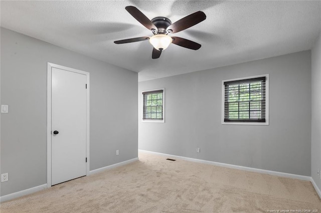1720 Paisley Ave, Fayetteville, NC 28304 - spare room featuring healthy amount of natural light, carpet floors, ceiling fan, and a textured ceiling