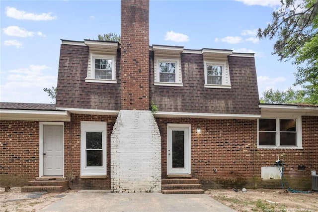 1720 Paisley Ave, Fayetteville, NC 28304 - view of front of home featuring entry steps, mansard roof, brick siding, and roof with shingles